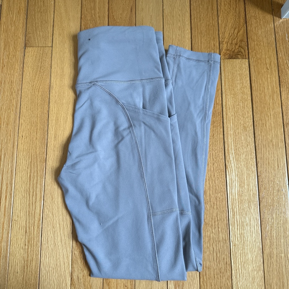 Aritzia TNA leggings in light purple/gray color